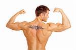 Muscular and tanned male with tatoo isolated on white