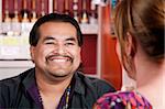 Handsome Native American man with female friend in a restaurant