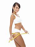 Young beautiful woman with measure tape on white