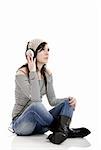 Young beautiful woman listening to music with headphones
