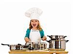 Happy little girl with chef hat making noise with the cooking pots and wooden spoons - isolated