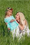 happy mother and daughter outdoors