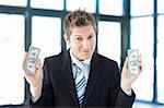 Young businessman holding dollars