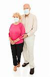 Worried senior couple wearing face masks to protect against flu epidemic.  Isolated on white.