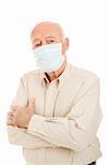 Worried senior man wearing a surgical face mask to protect against an epidemic.  Isolated on white.