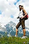 woman in mountains and see on high peak