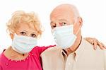 Senior couple wearing face masks to protect against swine flu epidemic.