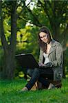 student with notebook in the park