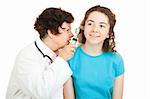 Female doctor checks inside the ears of her teenage patient.  Isolated on white.