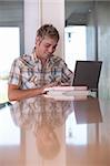 Portrait of Male Student working on laptop