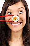 Funny picture of woman with salmon maki sushi