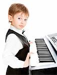 Little prodigy pianist looking at the camera
