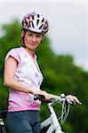 Smiling pretty girl in cycling wear