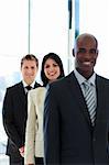 Brunette businesswoman in focus with her team