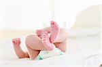 Newborn baby lying in bed