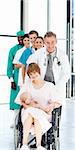 Doctors attending to a patient and her newborn baby in hospital