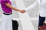 cropped view of two business women shaking hands. Copy space