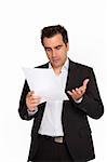 Businessman reads a document with query