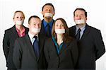 Group Of Business People With Their Mouths Taped Shut