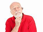 Senior man listening, using a hands-free set for his cellphone.  Isolated on white.