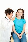 Doctor looking in a teenage patient's ears with an otoscope.  Isolated on white.