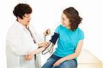 Gynocologist taking blood pressure of teenage patient.  Isolated on white.