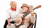 Senior man courts his lady love by playing banjo for her.  Isolated on white.