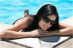 Beautiful Caucasian woman enjoying a day at the pool