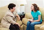 Counselor and teen girl have a friendly, positive conversation.
