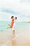 Laughing couple enjoying time together at the beach