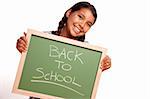 Pretty Hispanic Girl Holding Chalkboard with Back To School Isolated on a White Background.