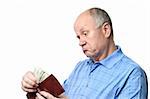 dissatisfied senior bald man is examining his cash savings