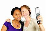 Isolated portrait of two teenage girls with camera phone