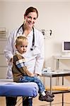 Doctor giving boy checkup in doctorÕs office