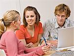 Students studying together in classroom