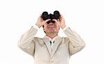 Close-up of a caucasian businessman holding  binoculars in front of the camera