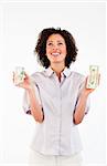 Smiling Afro-American businesswoman holding dollars and looking upwards