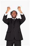 Afro-american businessman with raised arms smiling at the camera