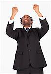 Happy afro-american businessman with raised arms looking upwards