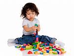 little boy playing with bricks