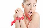 Beauty cosmetic portrait of funny tied hands woman with red tape