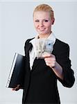 Young attractive woman holding dollars and a laptop