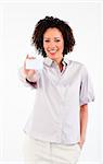 Afro-American businesswoman holding white businesscard and looking at the camera