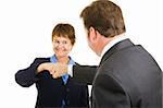 Mature businesswoman giving a fist bump to a male colleague.  Isolated on white.