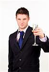 Businessman holding a champagne glass with camera focus on the glass
