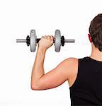 Young attractive sporty man lifting weights