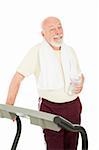 Handsome senior man on the treadmill with bottled water.  Isolated on white.