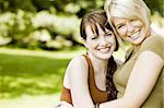 Happy young women embracing each other in the park