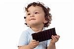 Child eats chocolate; isolated on a white background.