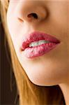 close up on a woman mouth pink colored and wet lips